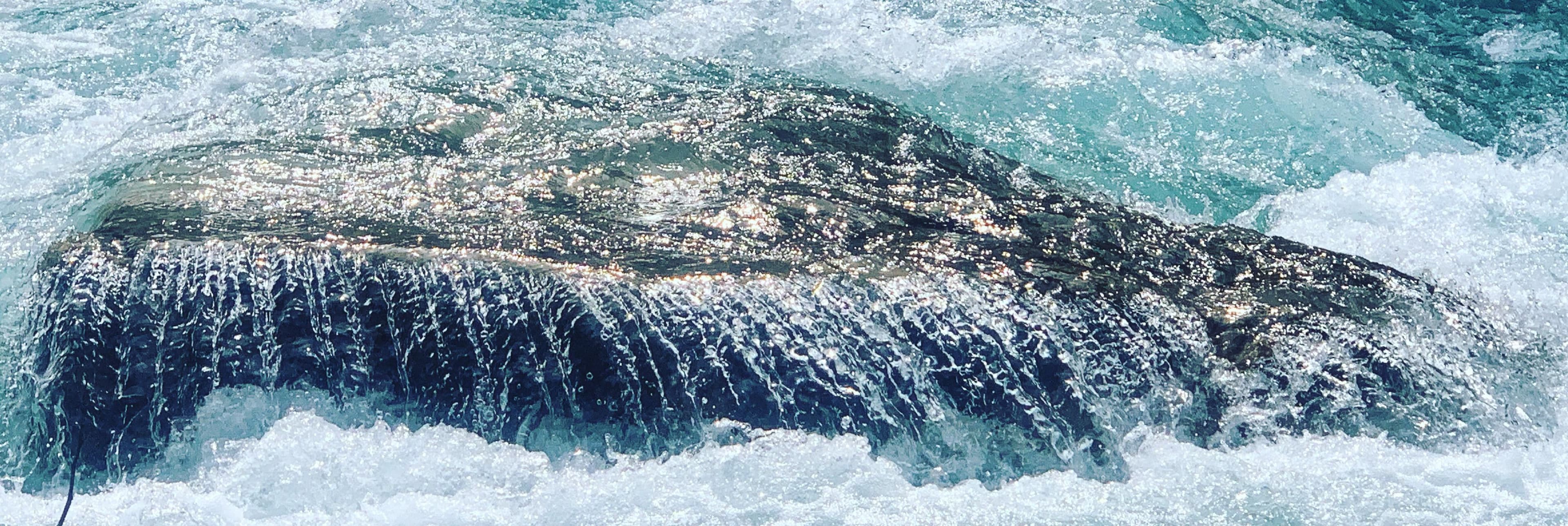 Water running over a rock