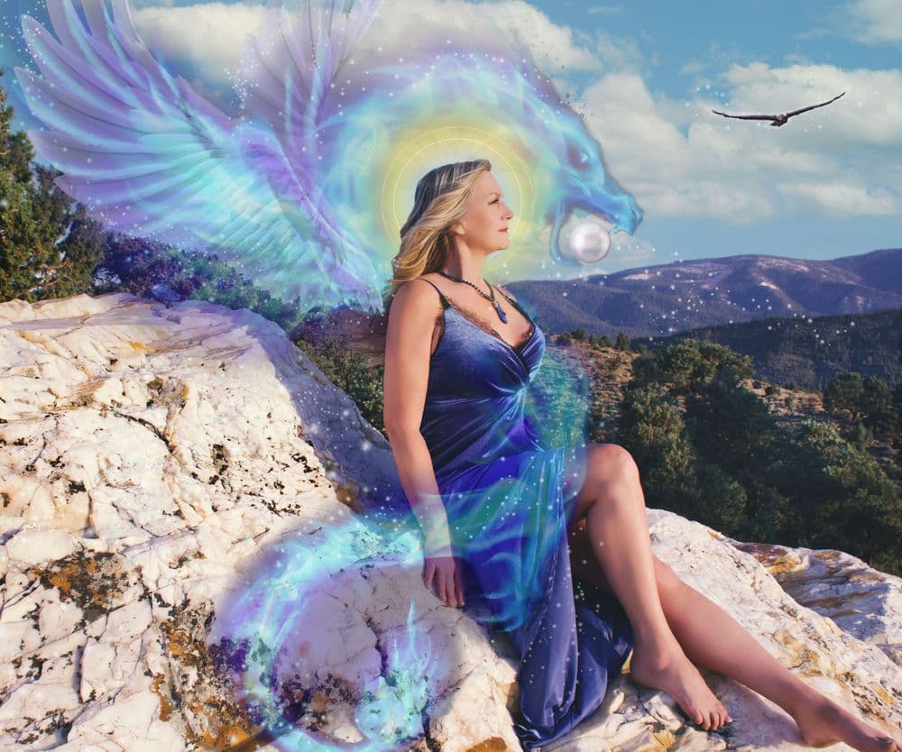 Elayne Le Monde sitting on a crystal rock